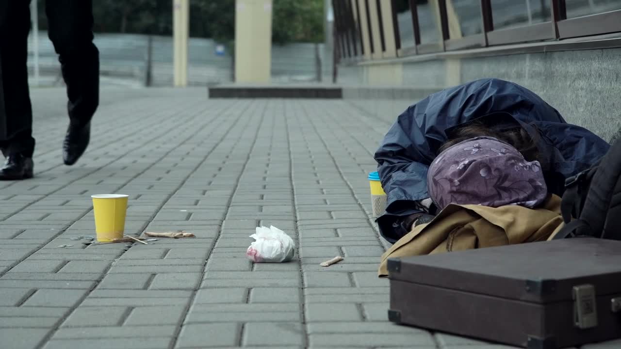 Stock Video Man Giving Money To Homeless Resting On The Street Animated Wallpaper - Free Download
