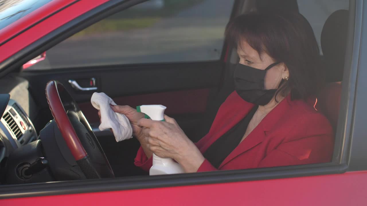 Free Stock Video Senior Woman Disinfecting The Steering Wheel Live Wallpaper - Free Download
