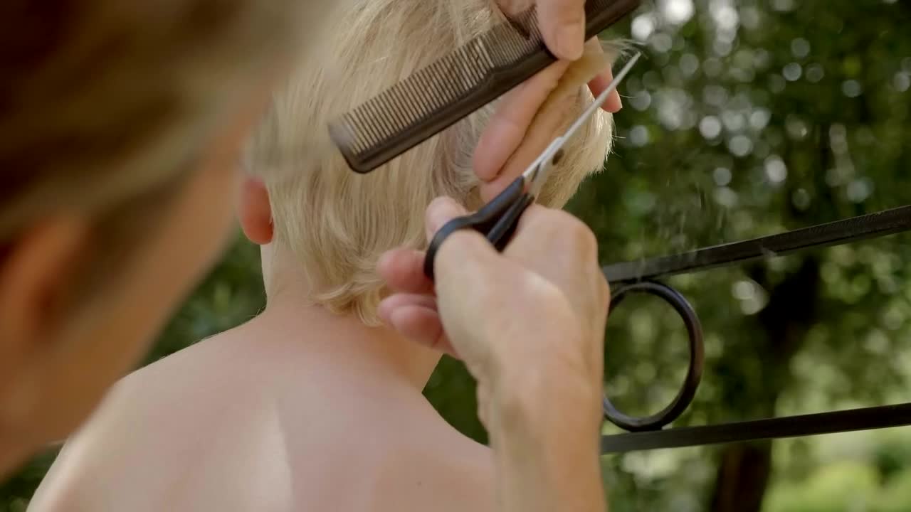 Stock Video Person Giving A Boy A Haircut Live Wallpaper - Free Download