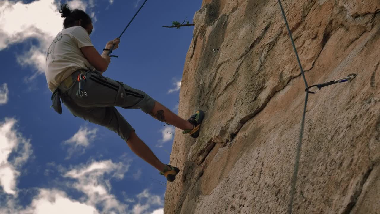 Stock Video Mountaineer Coming Down From A Mountain With A Rope Live Wallpaper - Free Download