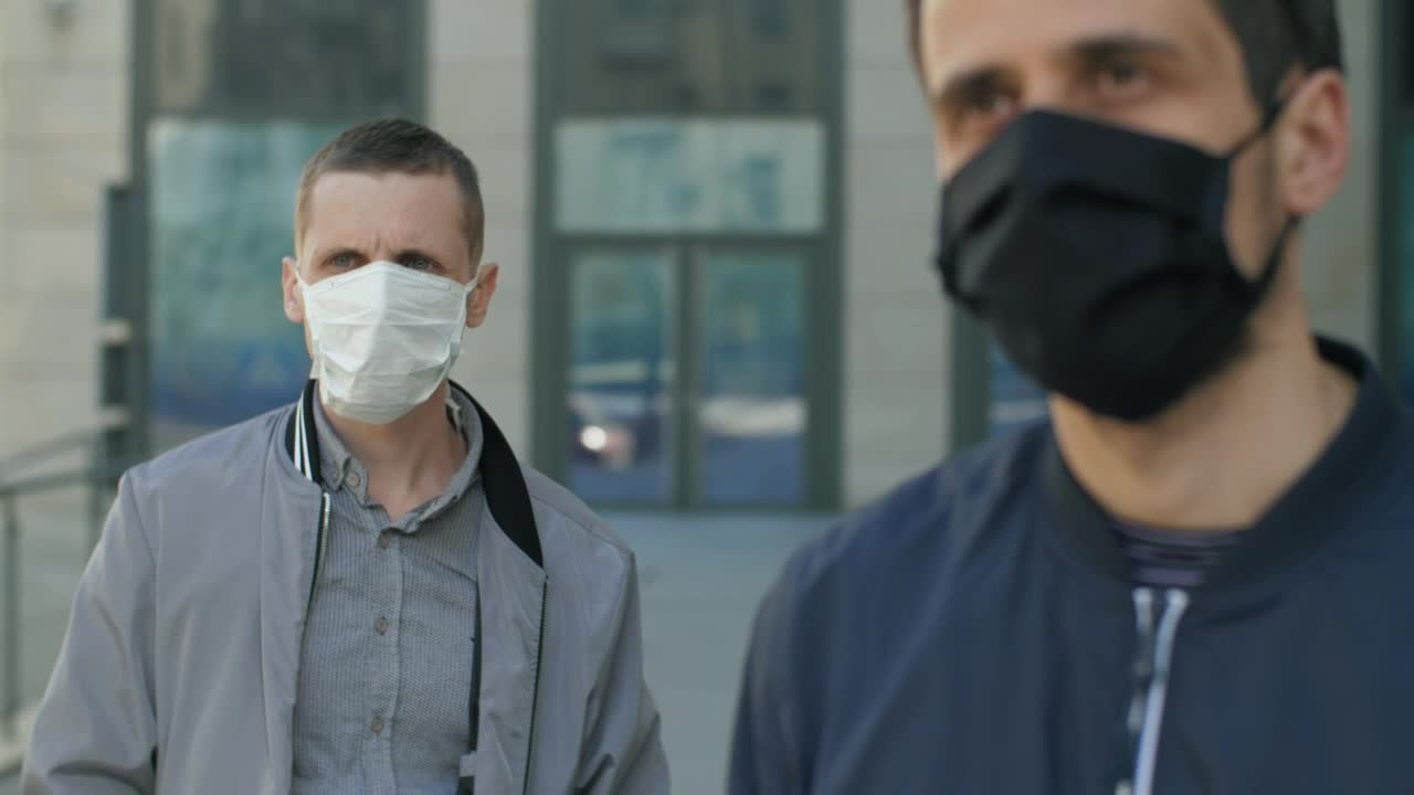 Stock Video Men Wearing Face Masks And Social Distancin Animated Wallpaper - Free Download