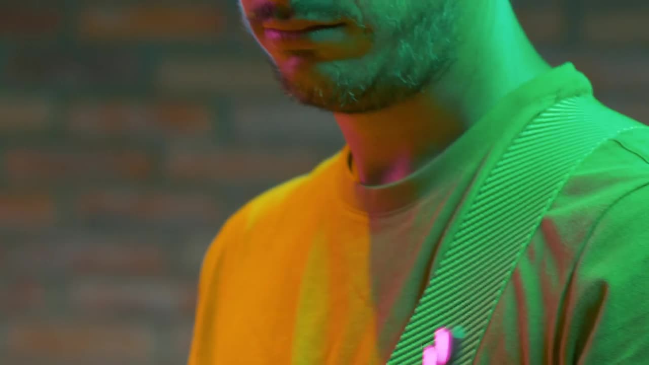 Free Video Stock tilt of a guitarist playing a song Live Wallpaper - Free Download