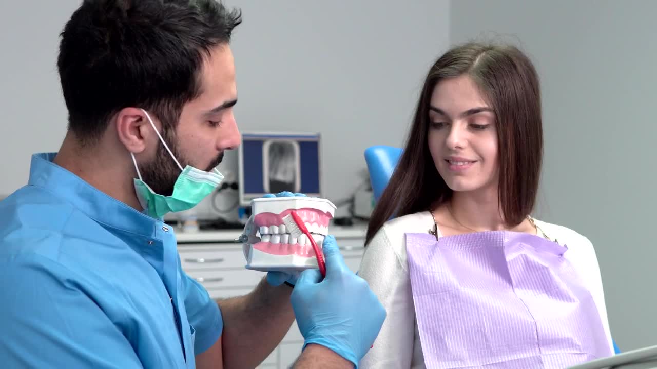 Stock Video Dentist Shows Woman Proper Teeth Brushing Live Wallpaper For PC - Free Download