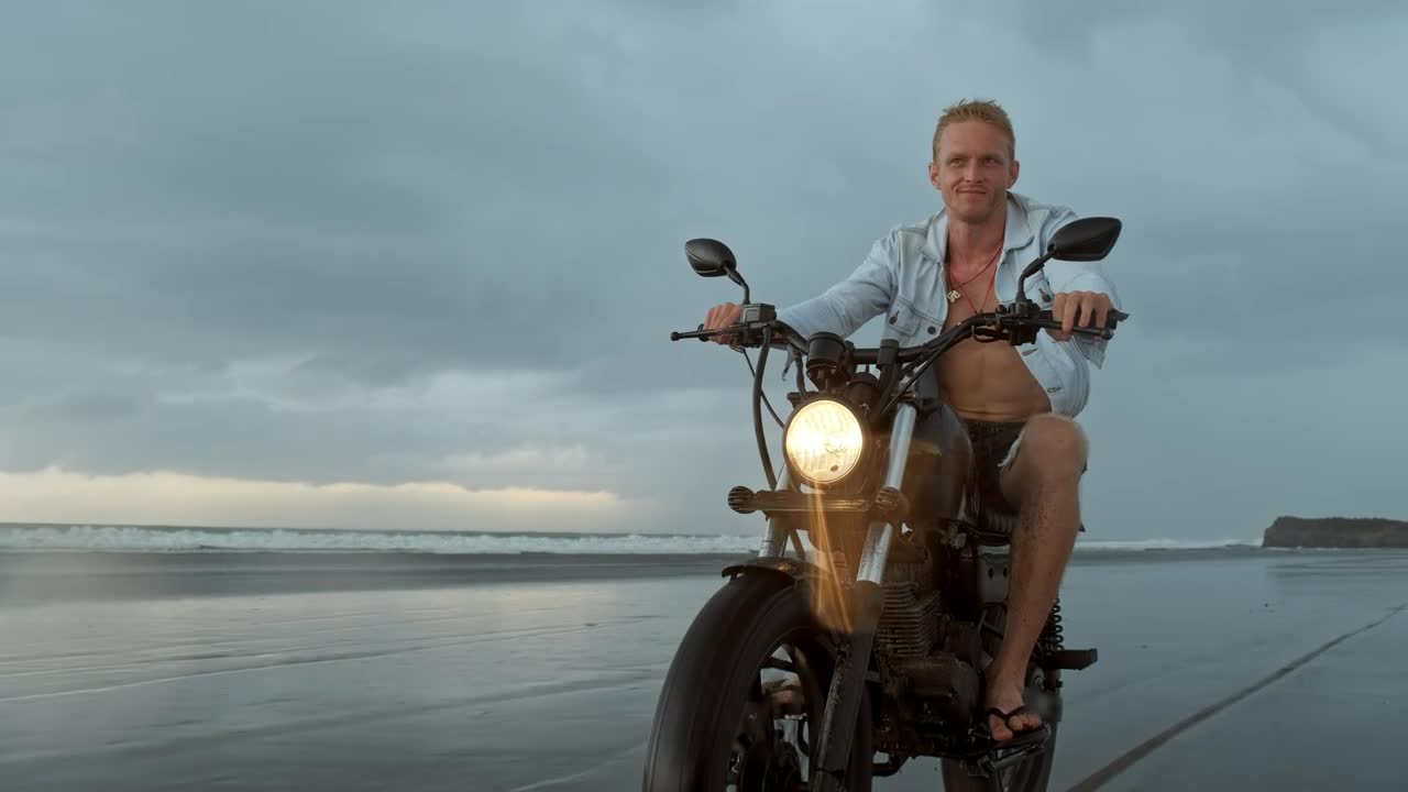 Stock Video Biker Riding His Motorcycle On The Beach Live Wallpaper For PC - Free Download