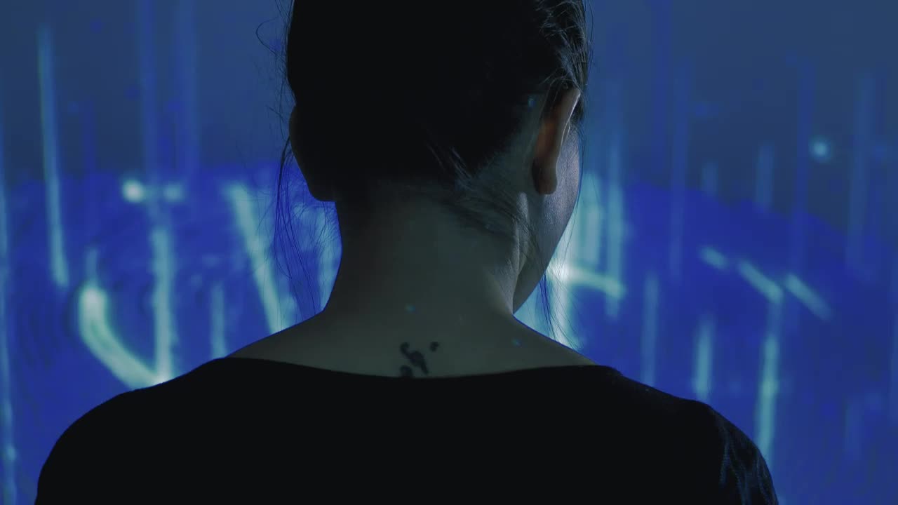 Stock Video Female Cyborg Watching To A Hologram Live Wallpaper For PC - Free Download