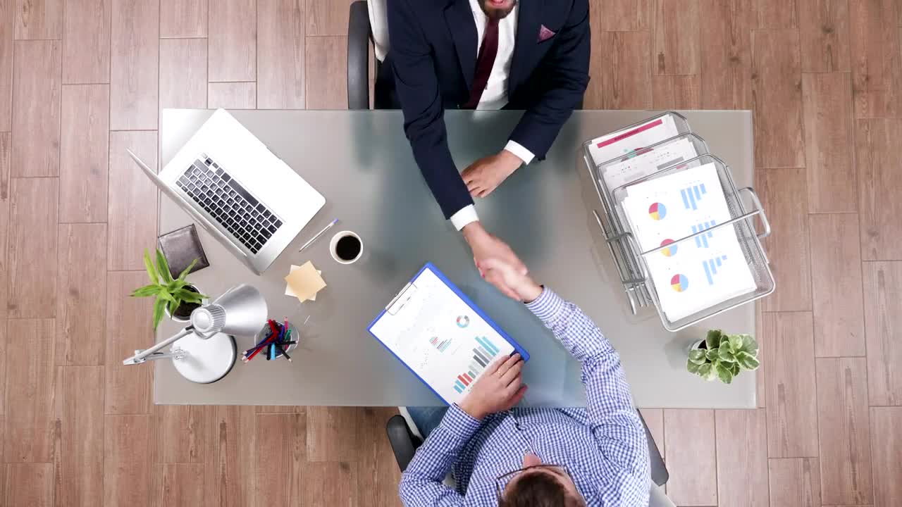 Free Video Stock top view of business handshake and client meeting Live Wallpaper - Free Download