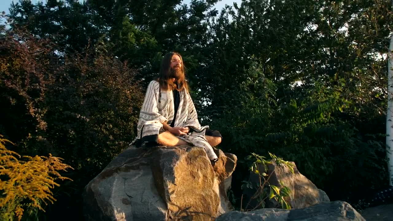 Free Video Stock Spiritual Man Meditating On A Rock In Nature Live Wallpaper - Free Download