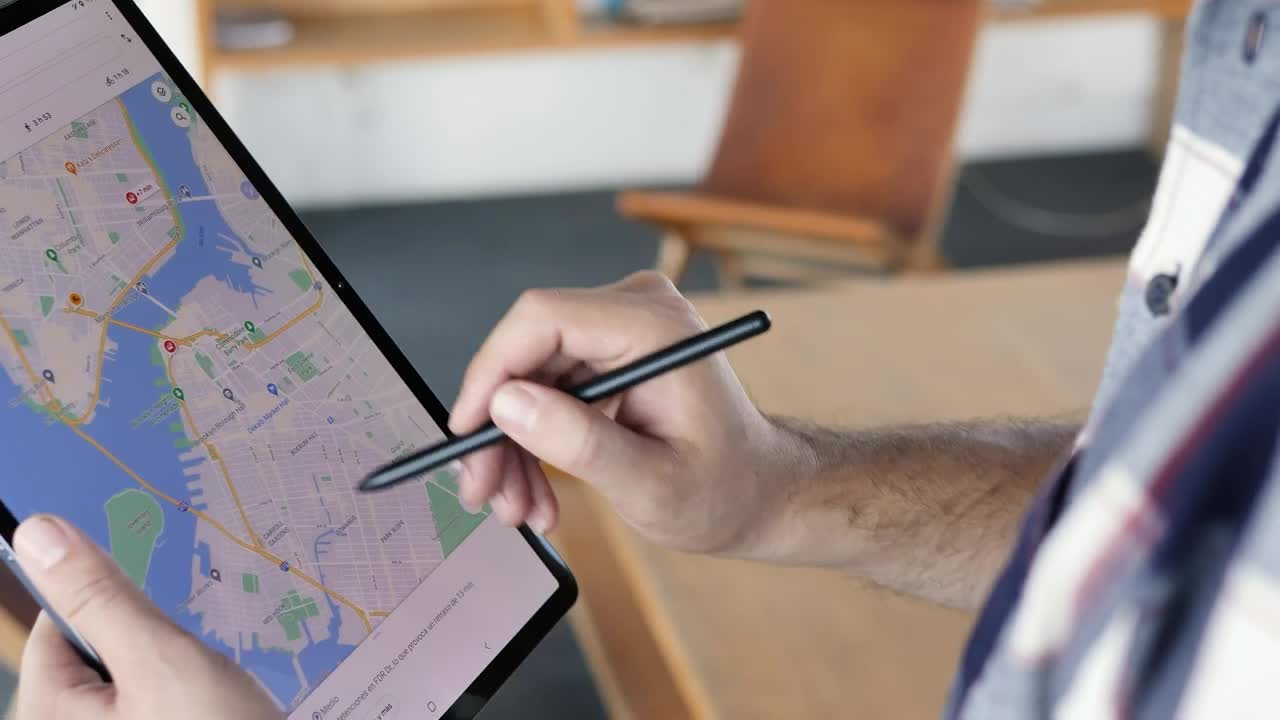 Stock Video Man Locating An Area On A Map On A Table Animated Wallpaper - Free Download