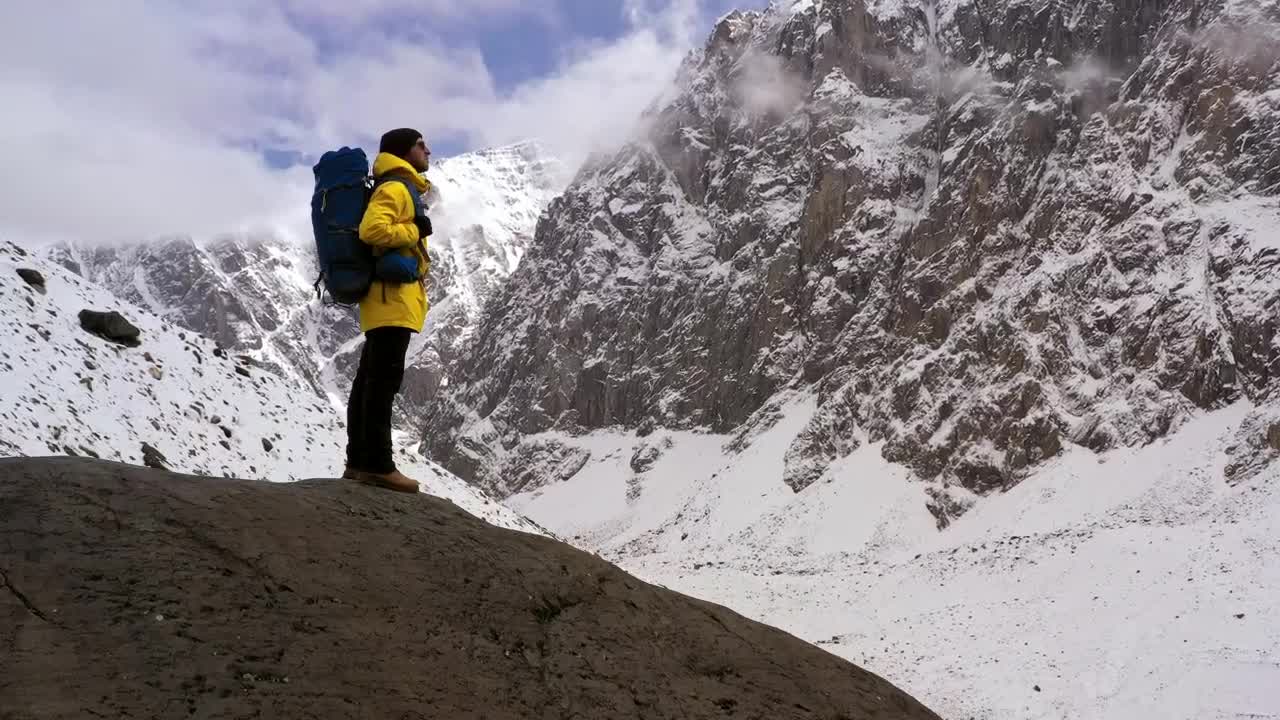 Stock Video Mountaineer Appreciating The View On A Snowy Mountain Live Wallpaper - Free Download