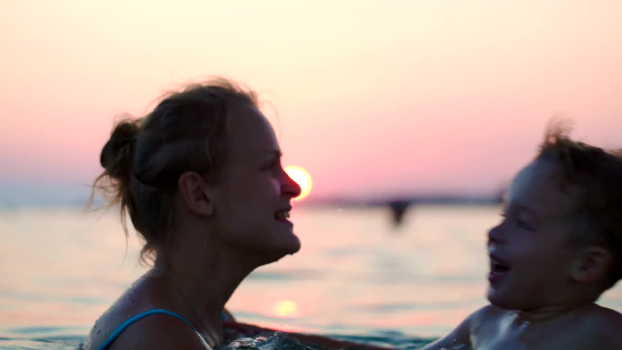 Stock Video Mother And Son Jumping In The Ocea Animated Wallpaper - Free Download