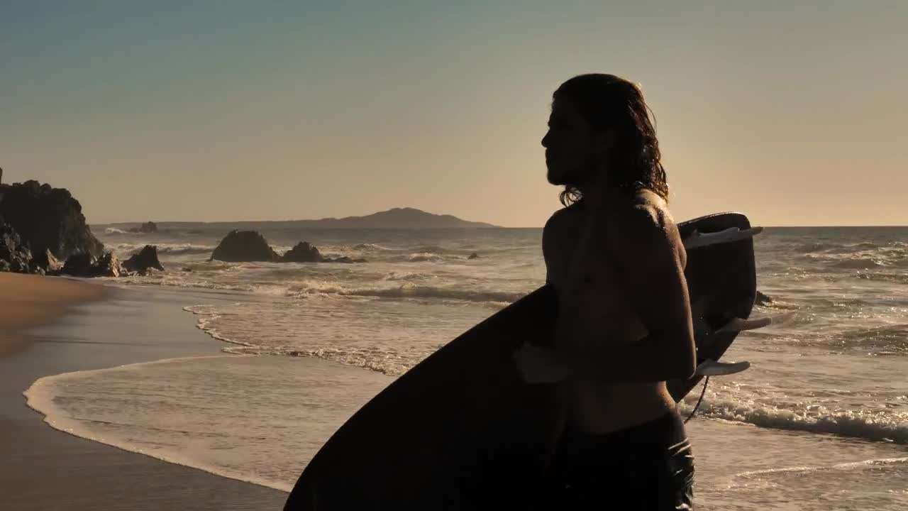 Free Video Stock surfer jogging on the beach with a board Live Wallpaper - Free Download