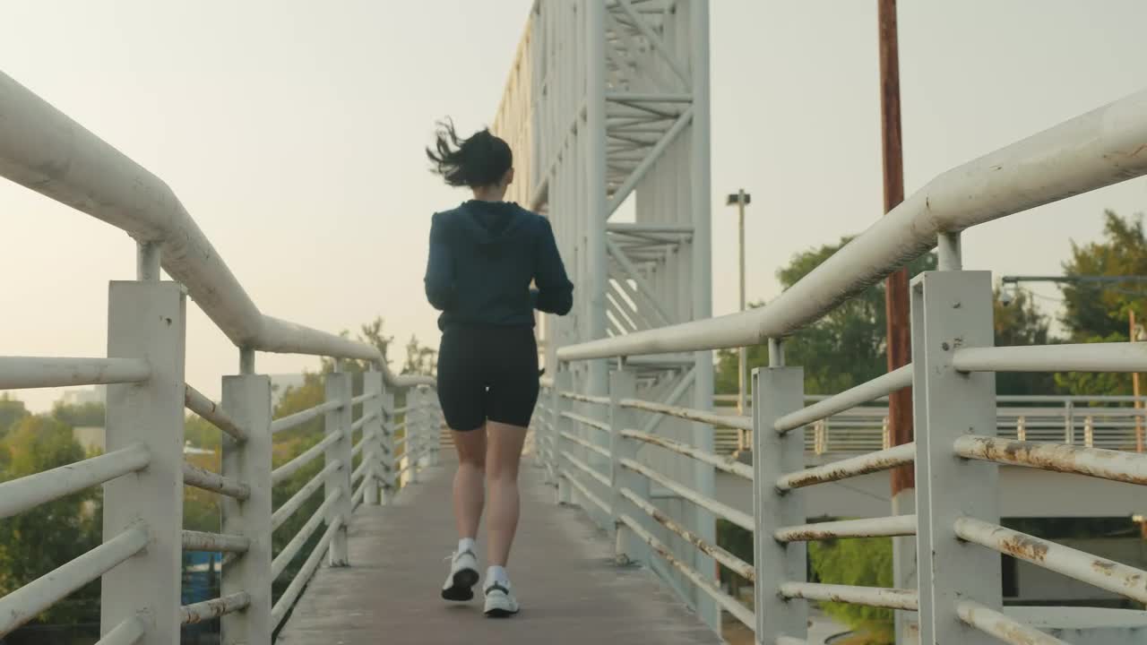 Free Stock Video Woman Jogging Across A Narrow Footbridge Live Wallpaper - Free Download