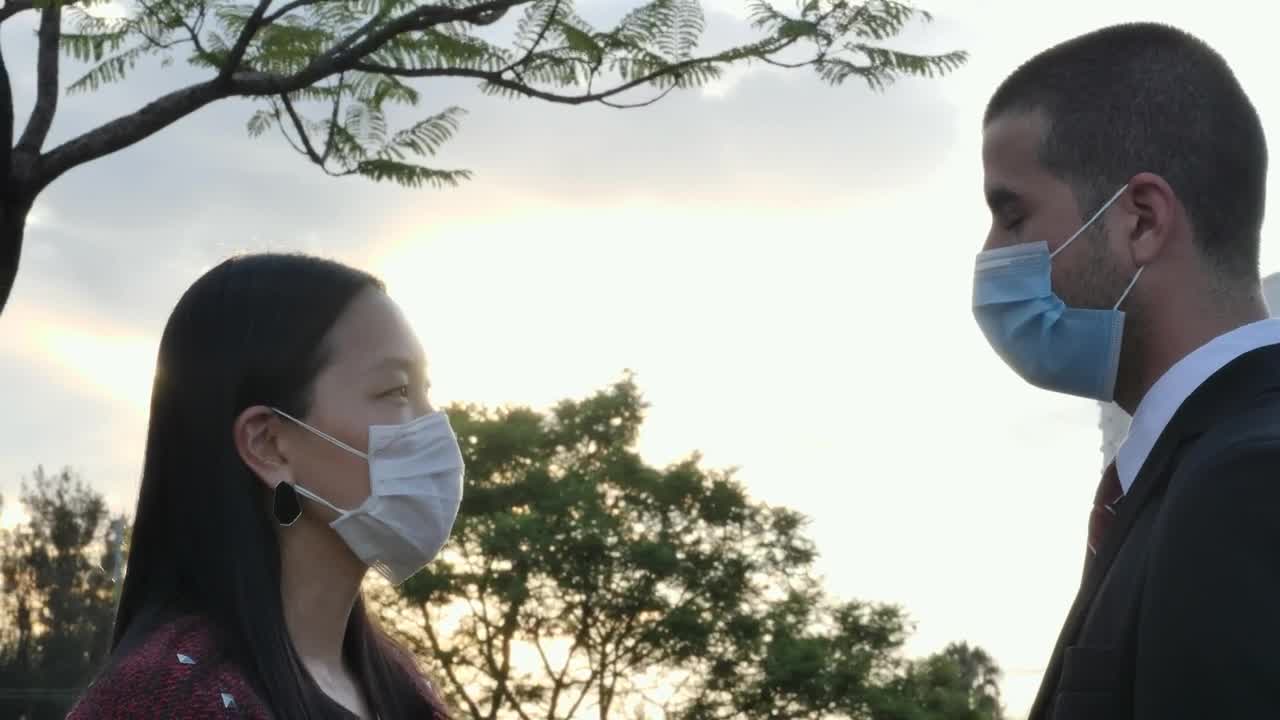Stock Video Couple Wearing Face Masks Under A Beautiful Sunset Live Wallpaper For PC - Free Download