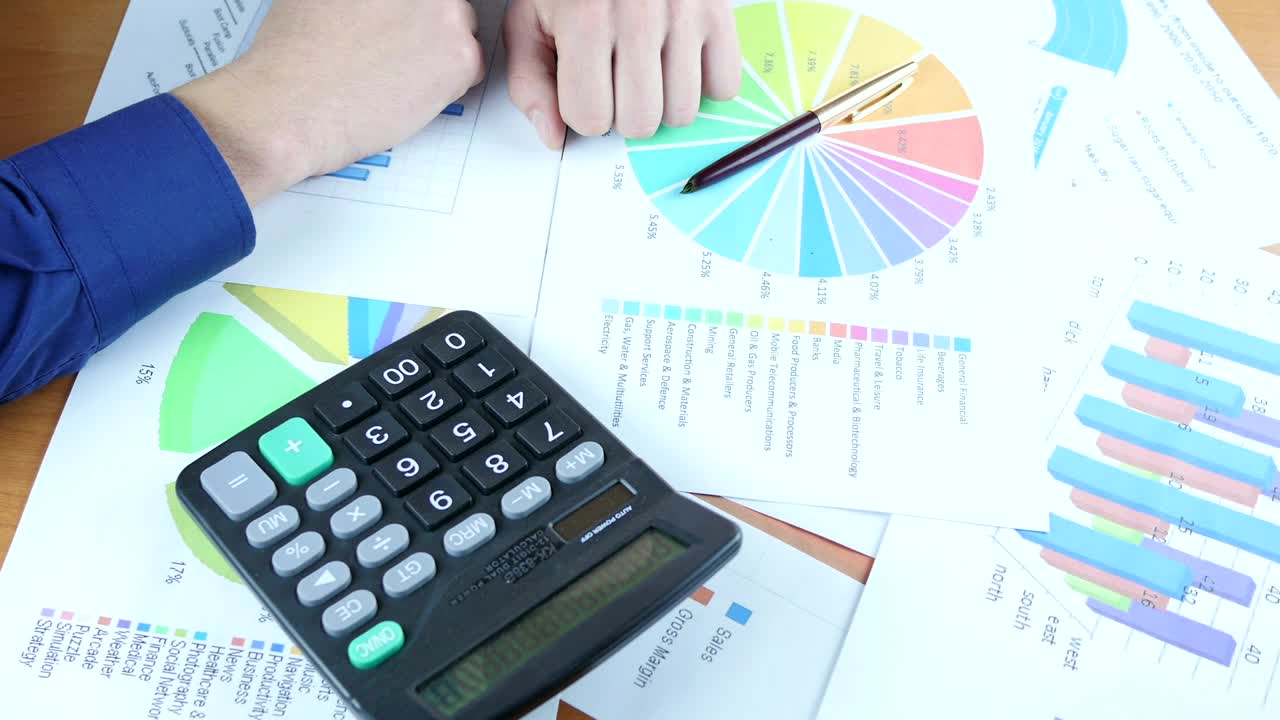 Video Stock Person Reviewing Graphs On Paper Live Wallpaper Free - Free Download