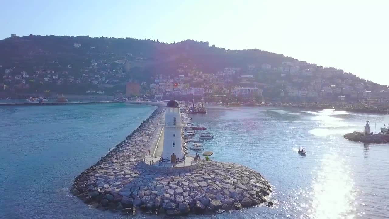 Stock Video Lighthouse At The Entrance To A Harbor Animated Wallpaper - Free Download