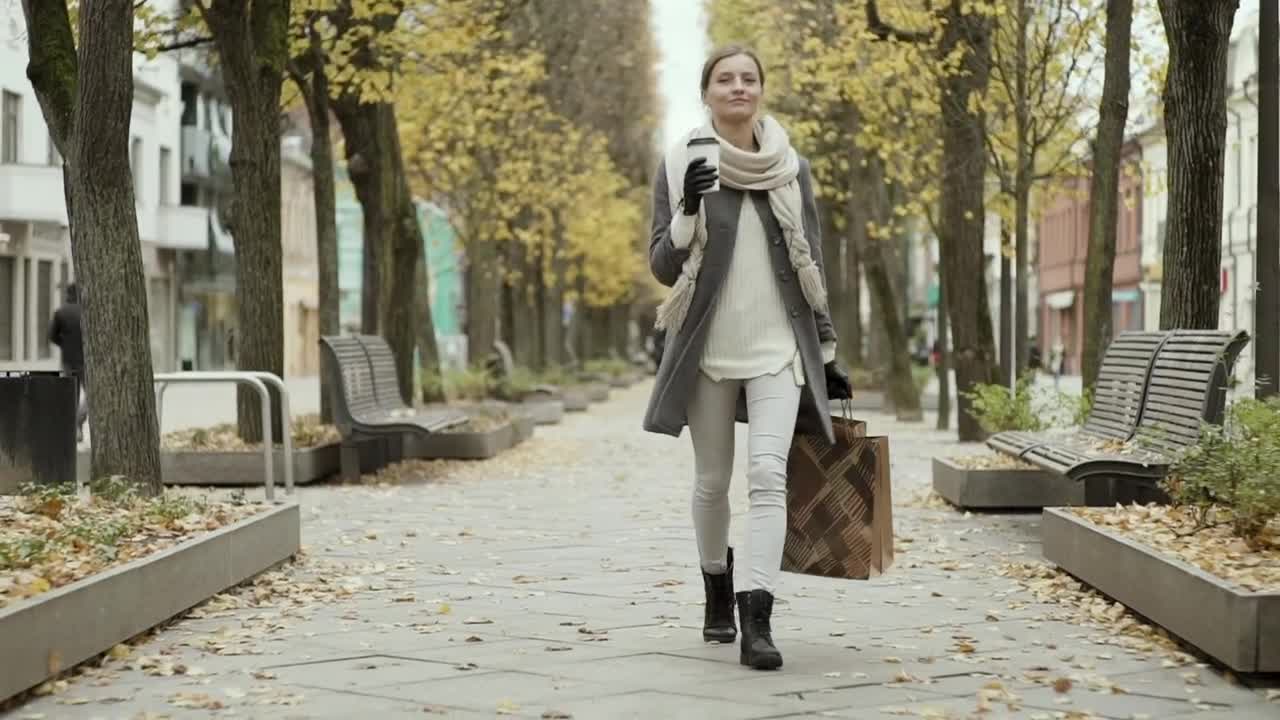 Stock Video Happy Woman Walking With Shopping Bags At Autumn Animated Wallpaper - Free Download