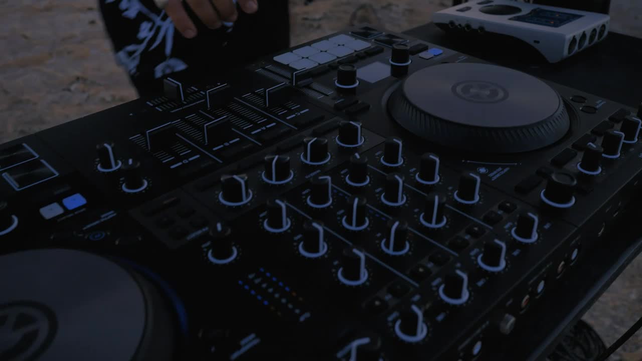 Free Video Stock talented dj playing in a desert in a close up shot Live Wallpaper - Free Download