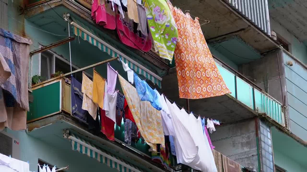 Video Stock Clothes Hanging On A Multi Story Building Live Wallpaper For PC - Free Download