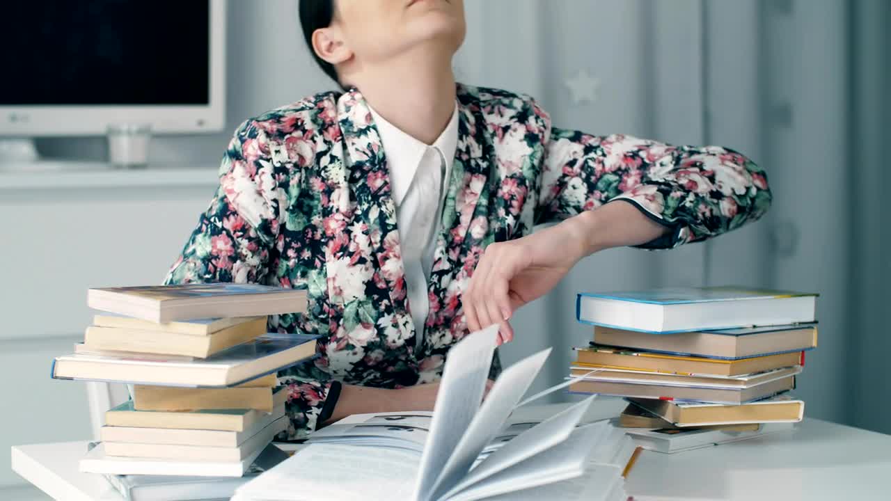 Stock Video Girl Bows Her Head Exhausted From Studying Live Wallpaper For PC - Free Download