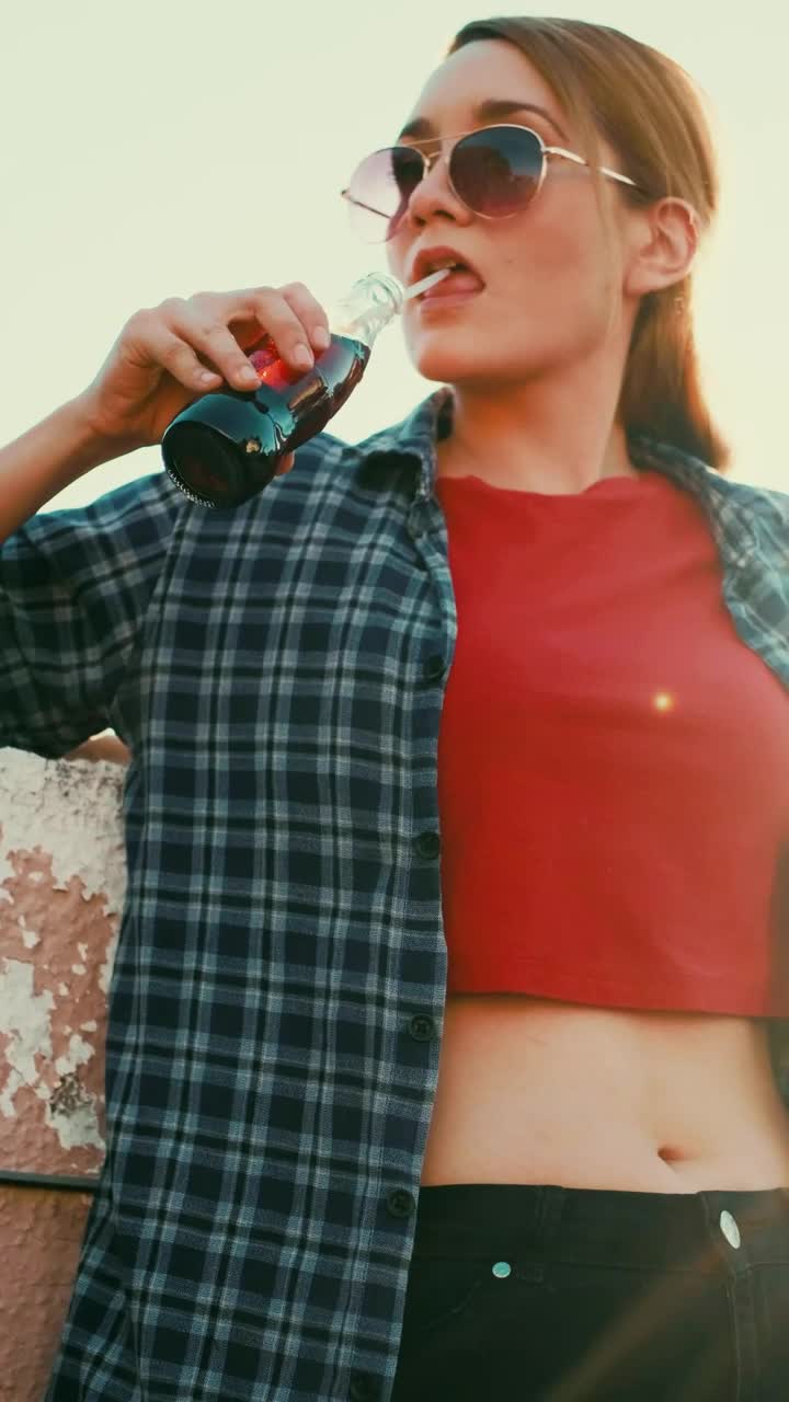 Stock Video Girl Drinking Soda From A Bottle With A Straw Live Wallpaper For PC - Free Download