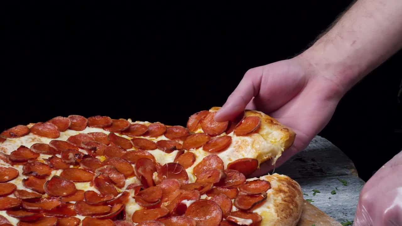 Free Video Stock taking a slice of fresh pizza Live Wallpaper - Free Download