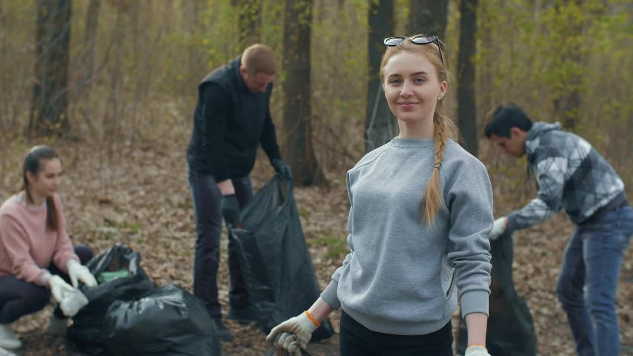 Free Stock Video Volunteer Showing The Trash She Recycles Live Wallpaper - Free Download