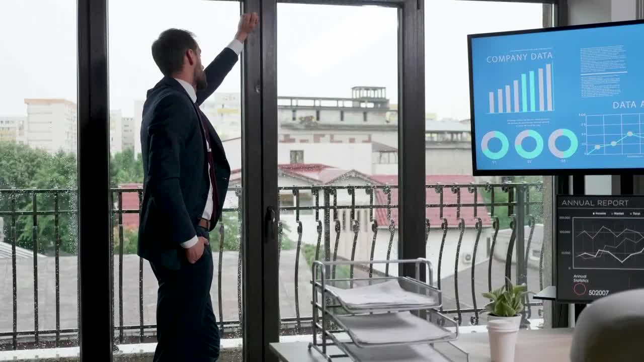 Video Stock Businessman In Suit Thinks In Front Of Office Windows Live Wallpaper For PC - Free Download