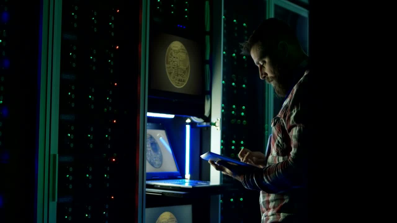 Stock Video Man Using A Laptop In A Dark Room Data Cente Animated Wallpaper - Free Download