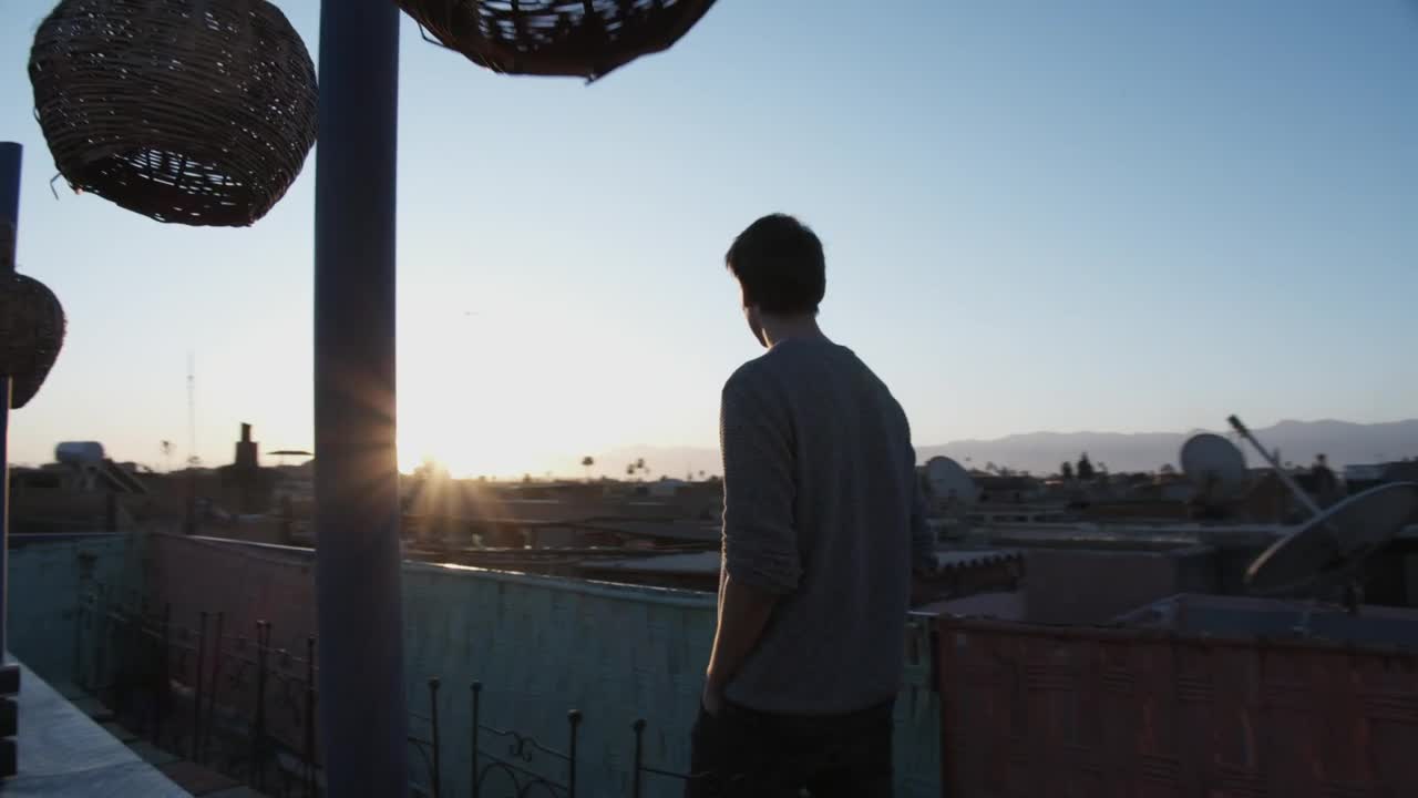 Stock Video Man Walks On The Rooftop With Sunrise Vie Animated Wallpaper - Free Download