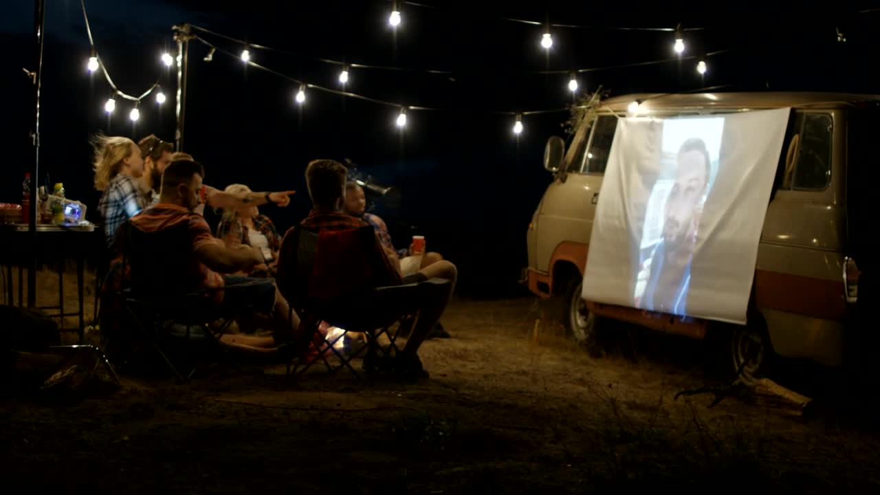 Stock Video Friends Watching A Live Stream With A Projection Live Wallpaper For PC - Free Download
