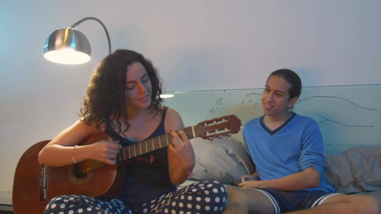 Stock Video Couple Hanging Out While She Plays Guitar Live Wallpaper For PC - Free Download