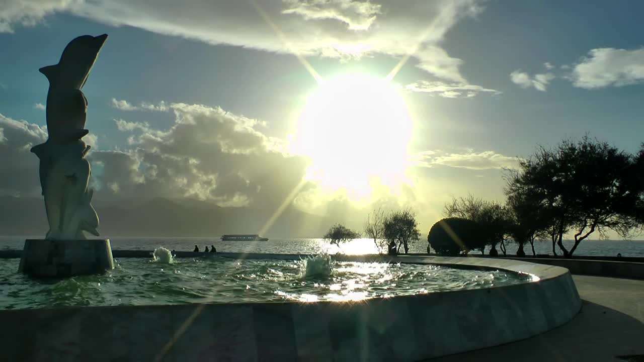 Stock Video Dolphin Statue In A Fountain On The Beach Live Wallpaper For PC - Free Download