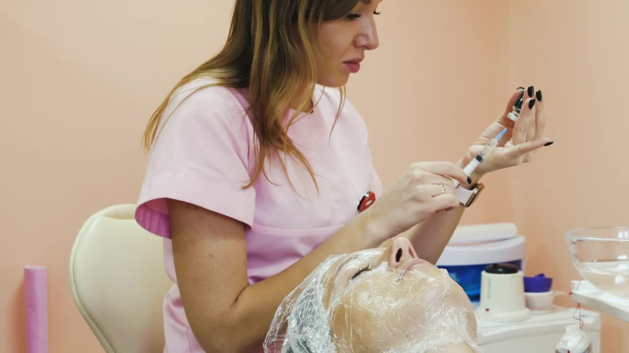 Stock Video Cosmetician Picking Up Medication Into Syringe Live Wallpaper For PC - Free Download