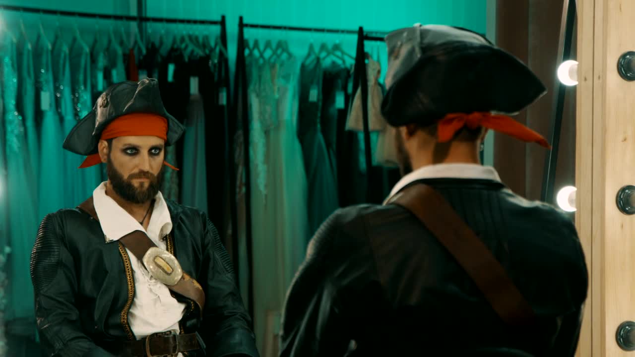 Stock Video Man In A Costume In Front Of A Mirror Animated Wallpaper - Free Download