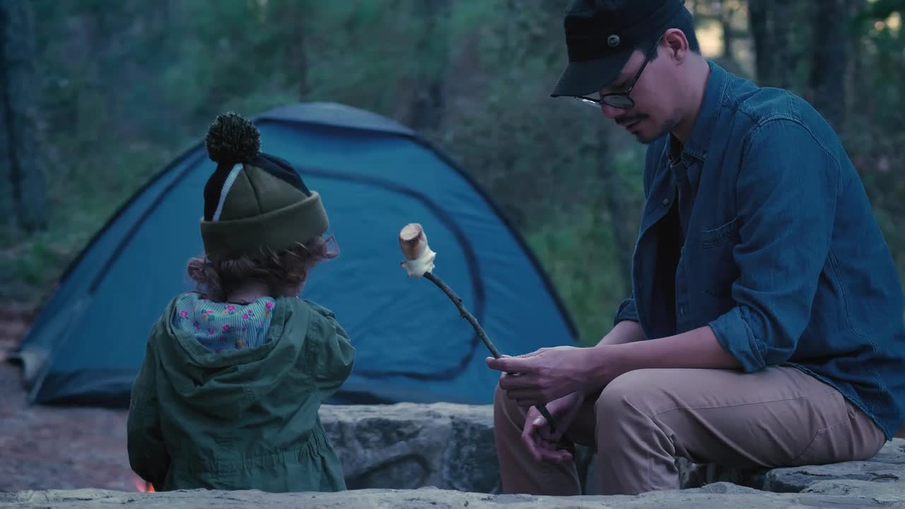 Free Stock Video Young Father Giving Roast Marshmallow To His Daughter Outdoors Live Wallpaper - Free Download