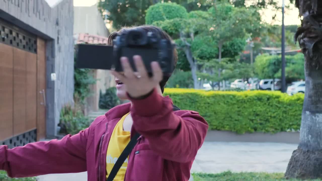 Stock Video Man Being Recorded Himself For A Blog On The Street Animated Wallpaper - Free Download