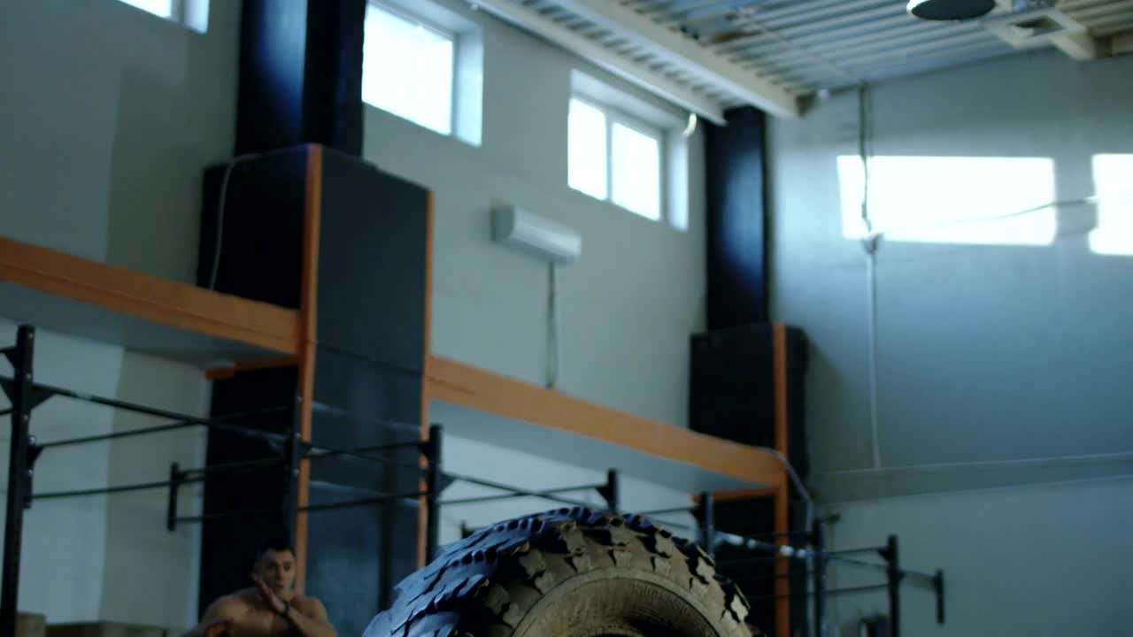 Stock Video Muscular Man Jumping A Tire In The Gym Live Wallpaper - Free Download