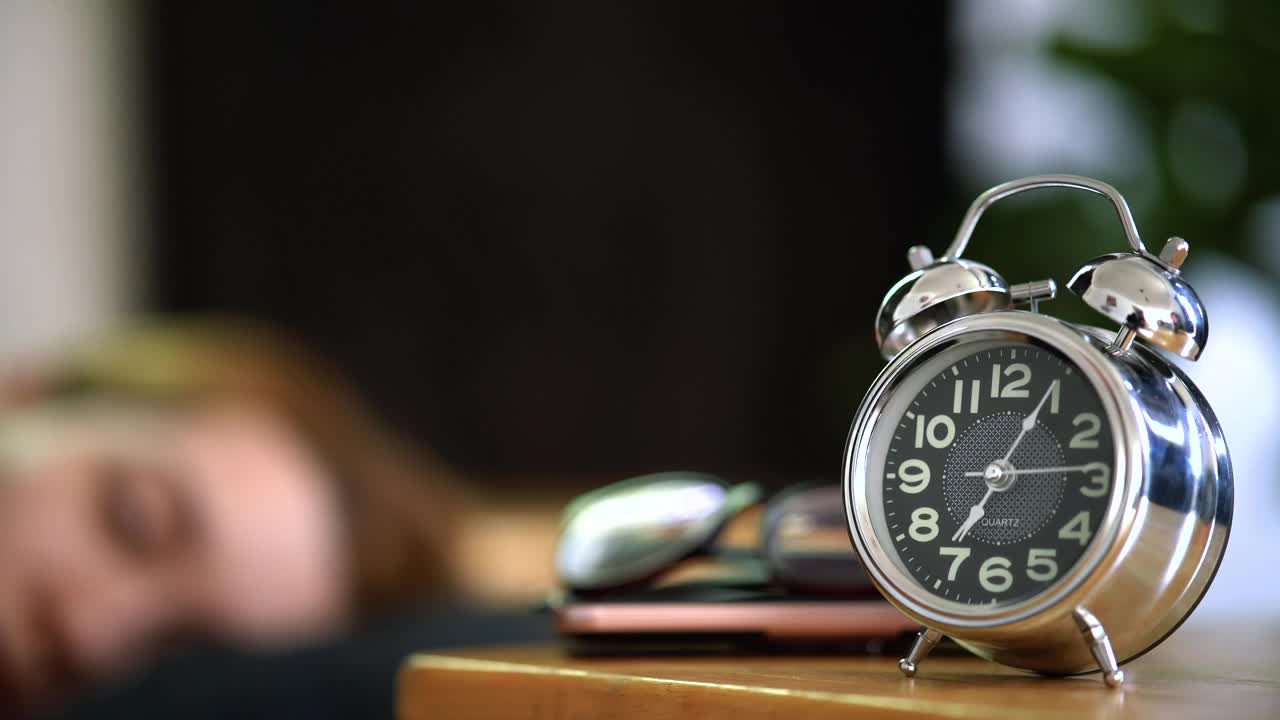 Free Stock Video Woman Turning Off Her Alarm Clock In The Morning Live Wallpaper - Free Download