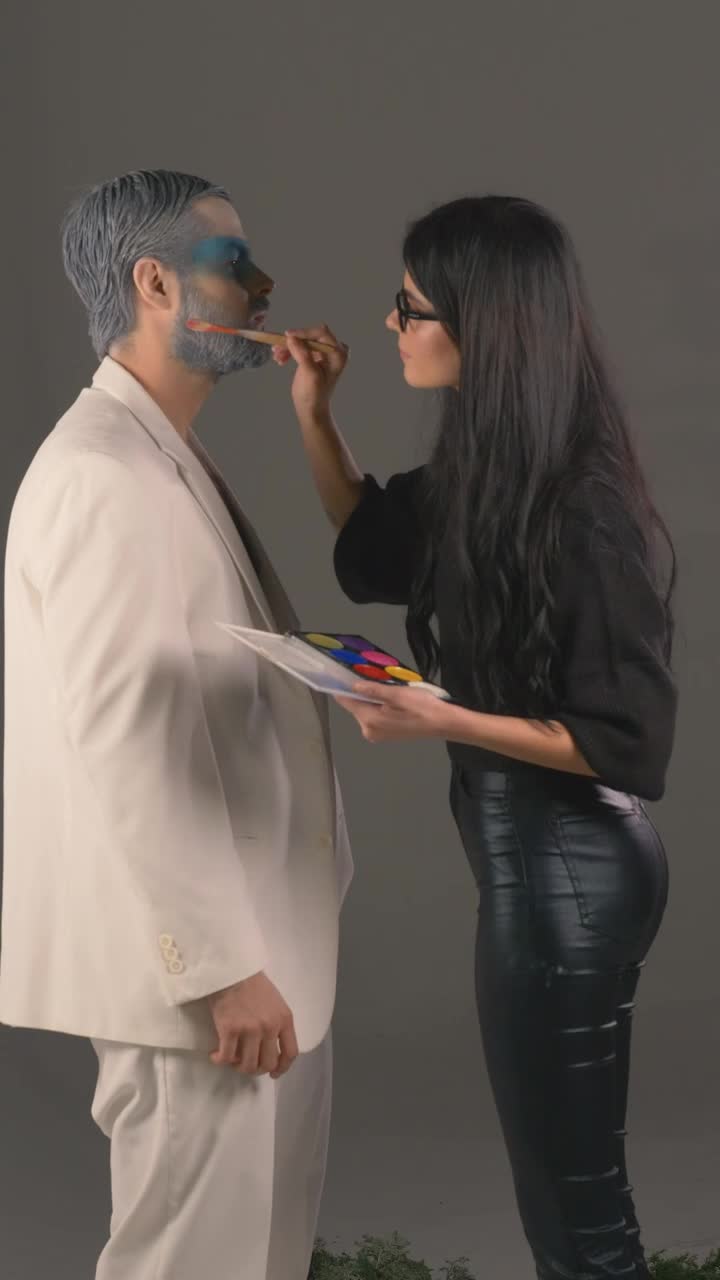 Free Stock Video Woman Putting Makeup On A Male Model Live Wallpaper - Free Download
