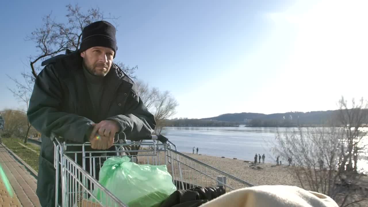 Stock Video Homeless Man With A Cart Of Plastic Bags Animated Wallpaper - Free Download