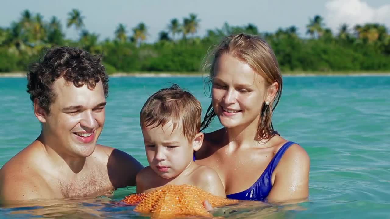 Stock Video Family Holding A Starfish Live Wallpaper For PC - Free Download