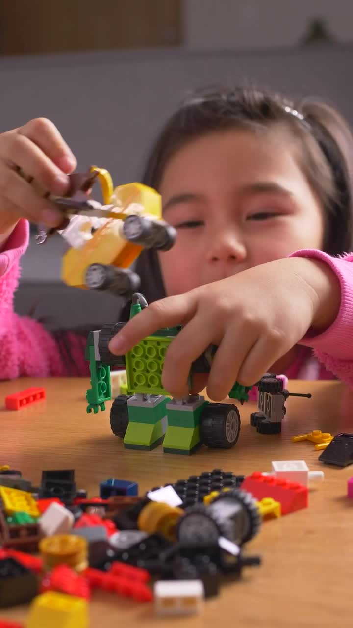 Stock Video Little Girl Playing With Her Legos Animated Wallpaper - Free Download
