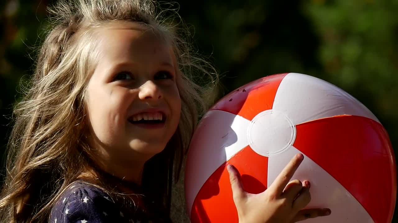 Stock Video Happy Girl With An Inflatable Ball Animated Wallpaper - Free Download