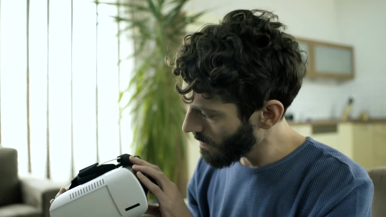 Stock Video Man Puts On A Vr Headse Animated Wallpaper - Free Download