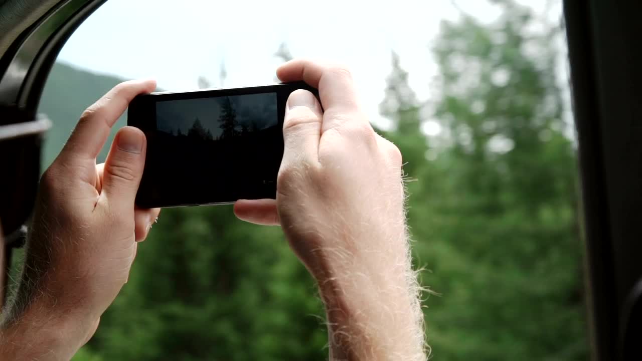 Free Video Stock tourist taking photos from a train with his mobil Live Wallpaper - Free Download