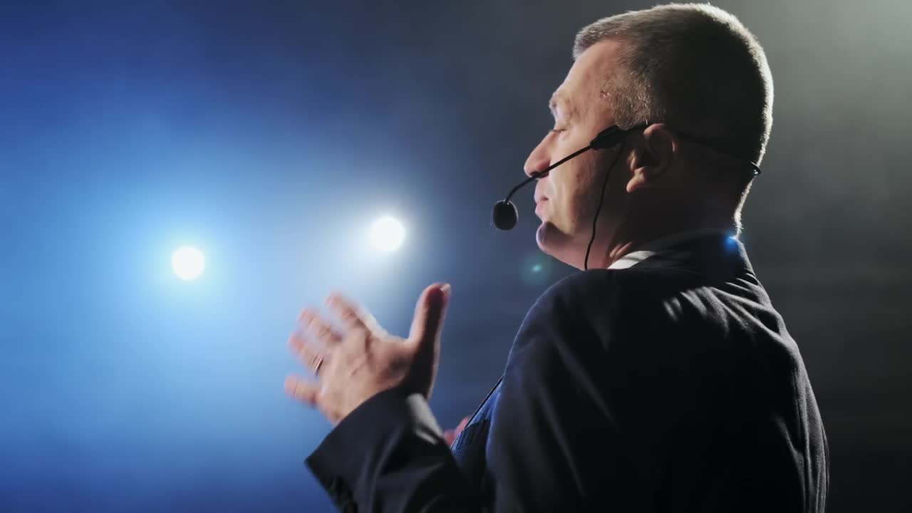 Free Video Stock Spotlights Illuminating A Successful Speaker On Stage Live Wallpaper - Free Download