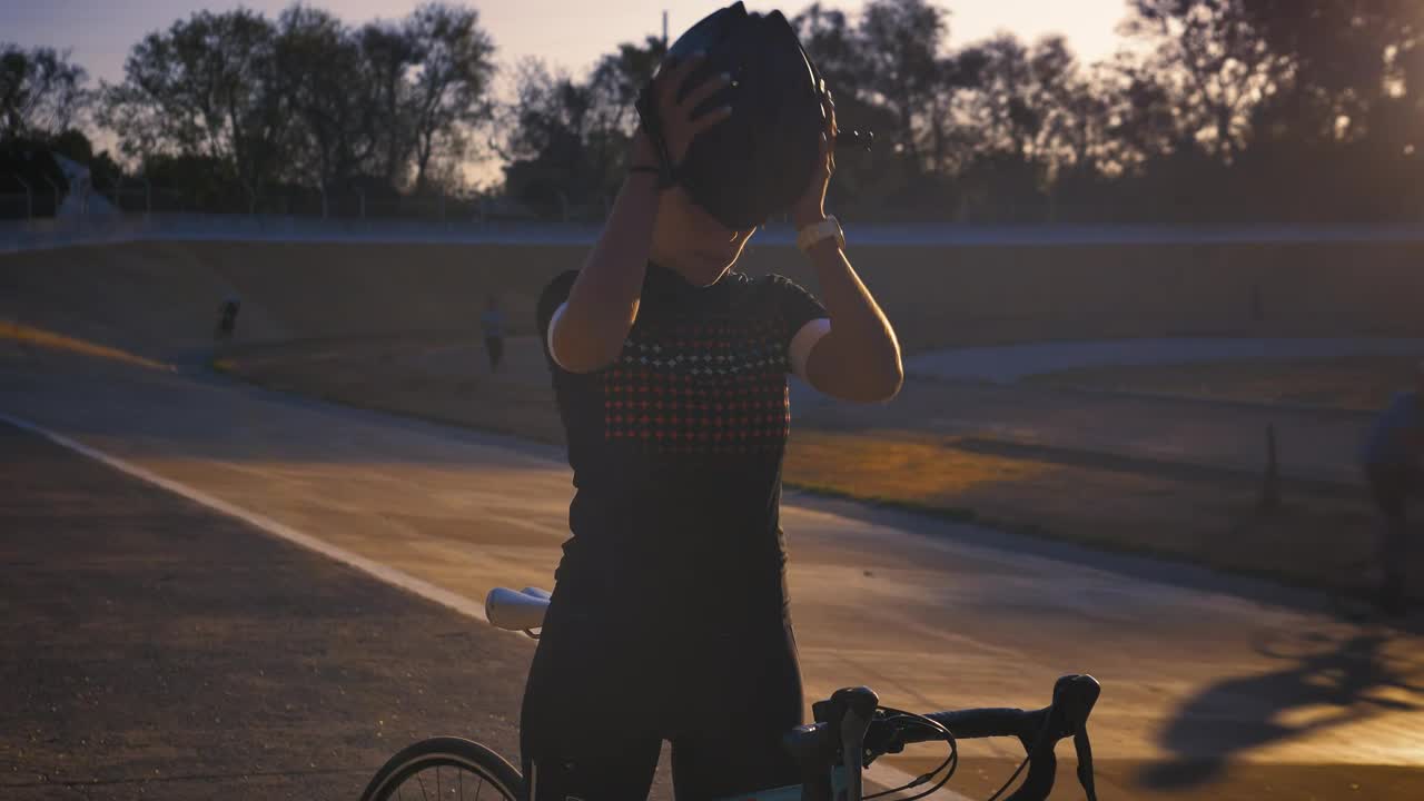 Stock Video Cyclist Putting On Her Helmet Before Training Live Wallpaper For PC - Free Download
