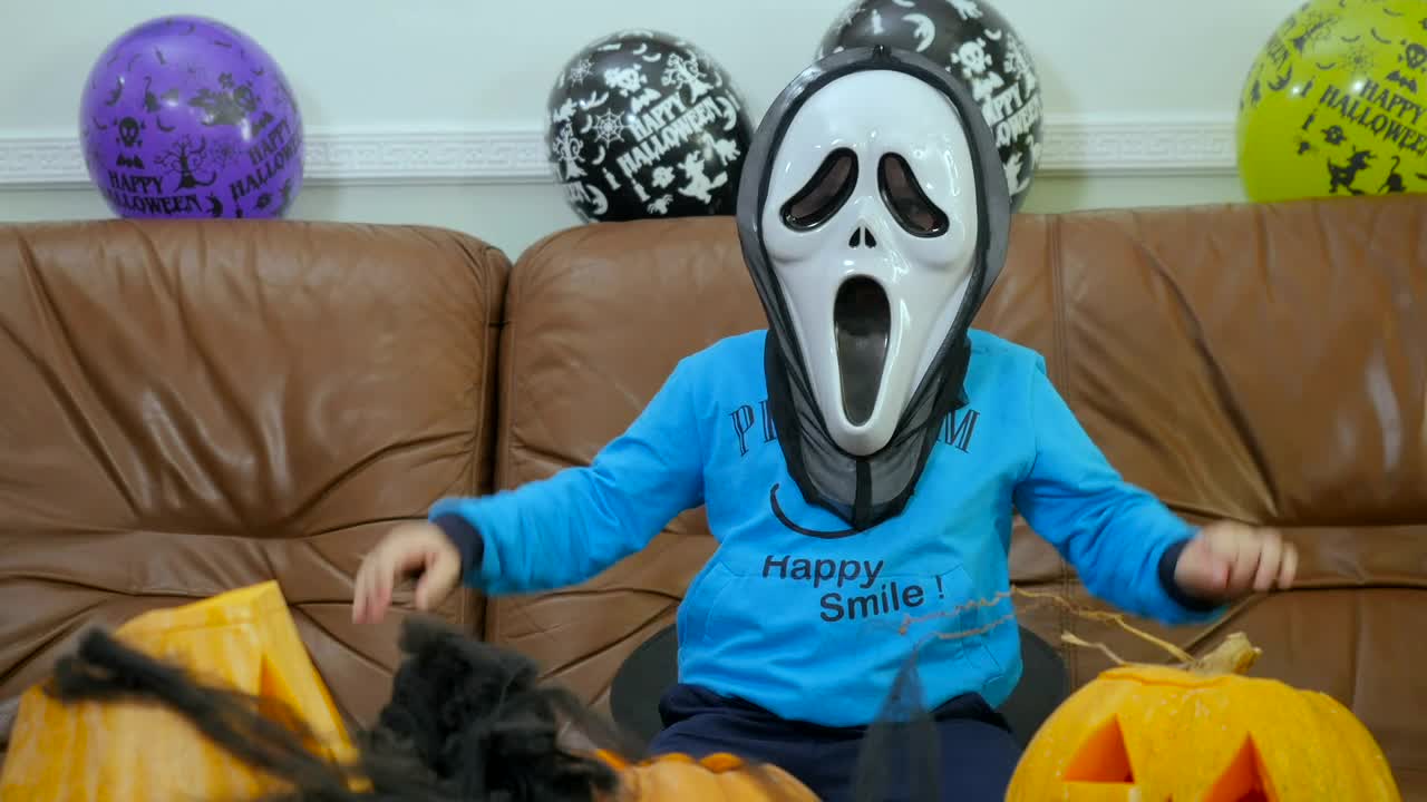 Video Stock Child In Scream Halloween Mask Makes Spooky Hand Gestures Live Wallpaper For PC - Free Download