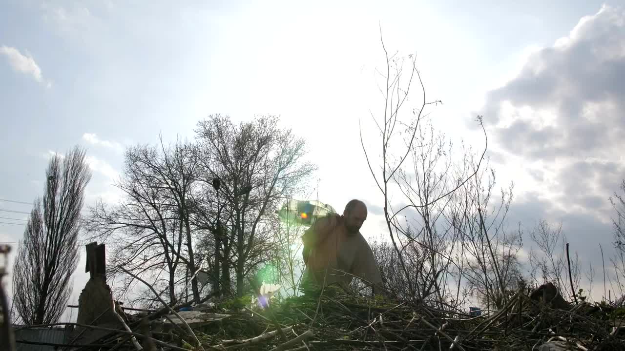 Stock Video Homeless Man Climbing Over Garbage Animated Wallpaper - Free Download