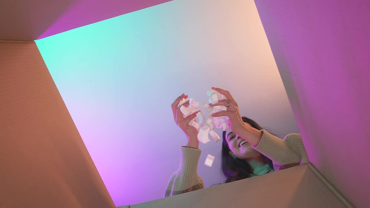 Free Video Stock Smiling Girl Putting Packing Filler In A Box Live Wallpaper - Free Download